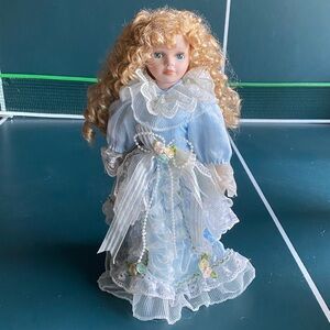 Elegant Blue Porcelain Doll with Lace Details 17”